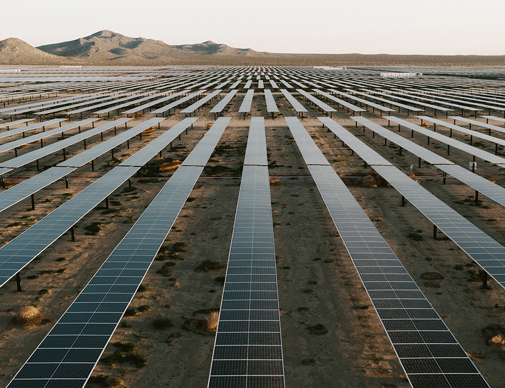 Rows of solar panels in a desert climate. 